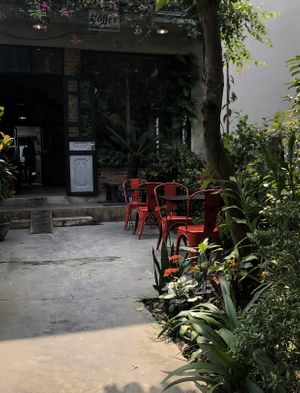 Outdoor seating. Two floors of indoor seating and out outdoor table on upper back balcony  at Brick Coffee in Ninh Binh