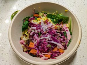 Saffron rice and greens. at CAVA - Domain Dr in Austin