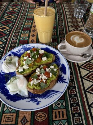 avocado toast (feta, no mushroom or bacon), passion passport smoothie, cappuccino - in total 220.000d  at Cosy Corner Cafe in Hoi An