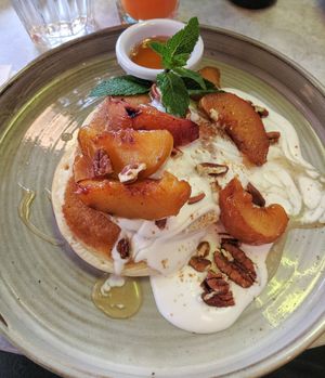 Sticky grilled peach pancakes with agave and coconut cream at Market Square in Folkestone