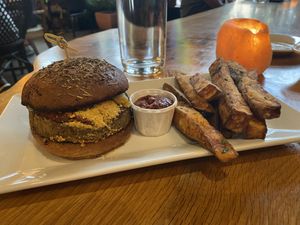 Chickpea parmesan sandwich with sweet potato fries  at ION - It's Only Natural Restaurant in Middletown