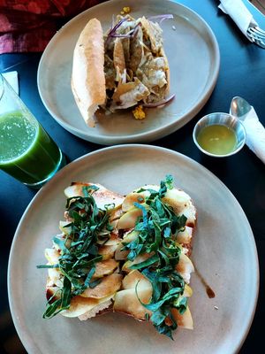 Torta de chilaquiles & Toast with ricotta, pear slices & spinach at VegCo Restaurante Vegano in Queretaro