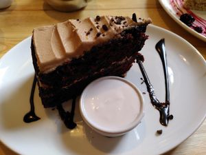 Chocolate and orange cake, with coconut cream (August 2022) at Goji Vegetarian Cafe and Deli in York