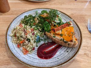 Cashew cream & butternut squash tart, with a selection of salads at Goji Vegetarian Cafe and Deli in York