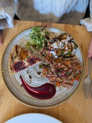 Cashew tart with aubergine salad and quinoa salad. at Goji Vegetarian Cafe and Deli in York