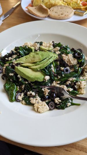 Tofu scramble with spinach, black olives, and avocado at Claire's Corner Copia in New Haven