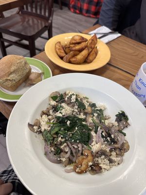 huge portions! tofu scramble with roll and potato wedges  at Claire's Corner Copia in New Haven