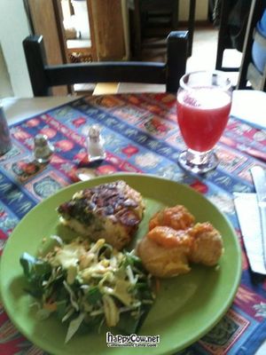 Vegetables omelette, potatoes with peanut sauce, salad, and watermelon juice. at Quinua y Amaranto in Bogota
