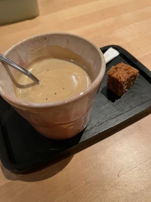 Coffee with non-dairy milk and a vegan pastry  at De Zeezot in Westkapelle
