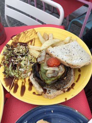 One of four types of vegan hamburgers on menu. This is remolacha (beet).  Served with fries and cabbage salad with balsamic vinegar dressing   at Vintage El Palmito in Cadiz