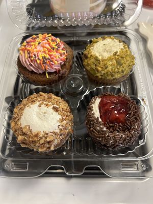Maple raspberry, pistachio, carrot cake, and black forest cupcakes at Edge of the Woods Natural Market in New Haven