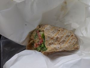 Edge Burger with tahini sprouts and veggies no cheese on a whole wheat wrap at Edge of the Woods Natural Market in New Haven