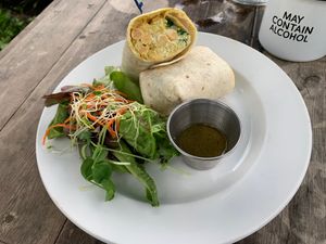 Chickpea Curry Wrap. Such great flavor. I would order this again in a heartbeat. (The hot chocolate in the mug didn’t contain alcohol but it was incredible.) at Russell's by Eat Healthy Kauai in Wailua