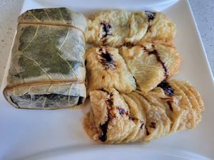 Bean curd sheet roll and sticky rice in lotus pocket at King's Cafe in Toronto