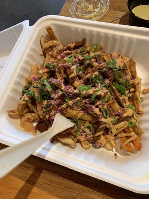 French fries with chipotle sauce and bacon at Moonrise Comida Vegana in Guatemala City