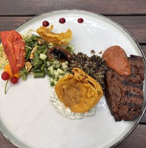 Seitan steak, onion badji and lots of different textures and flavors   at De Levensboom in Hasselt