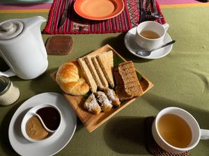 Breakfast bread platter and coffee at BeingSattvaa in Ubud