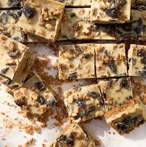 Vegan, Gluten-free, Refined Sugar-free Dates, Walnuts & Tahini Biscuit Squares - crunchy walnuts & sweet dates coated in pure cacao butter on a tahini biscuit base  at Noor Healthy in Amman