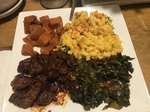Large plate 1 main and 3 sides… ribs, yams, mac and greens. at Vegan Mob in Oakland