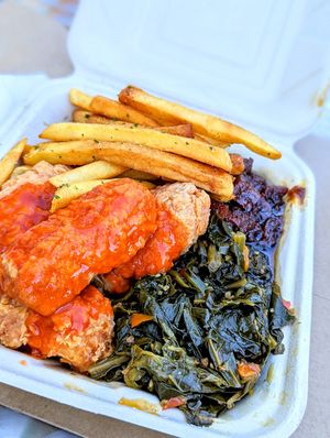 Fried Chicken with Buffalo Sauce, Greens, Sweet Potatoes, and Fries at Vegan Mob in Oakland