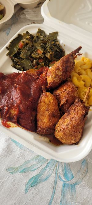 Plate with lemon pepper wings and brisket at Vegan Mob in Oakland