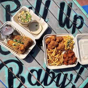 Large Mob Plate with Spicy Fried Chicken, Smackaroni, Mob Fries, and Sweet Candied Yams. A Fried Grilled Cheese with Garlic Fried Rice.  at Vegan Mob in Oakland