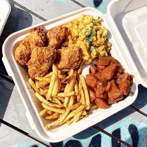 Large Mob Plate with Spicy Fried Chicken, Smackaroni, Mob Fries, and Sweet Candied Yams.   at Vegan Mob in Oakland