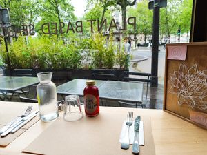 View from window seating towards terrace with Chai Hibiscus Kombucha 😉 at apeti - Ségur in Paris