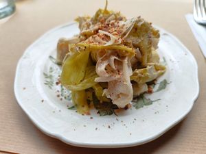 Marinated leeks, almond, lemon, cacao beans at apeti - Ségur in Paris