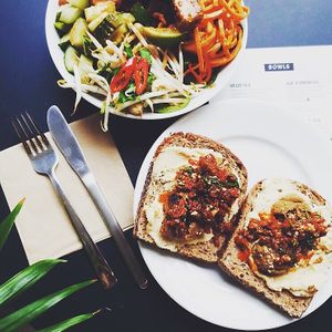Bali bowl and falafel and muhammara on toast  at Oliver Green - East in Amsterdam