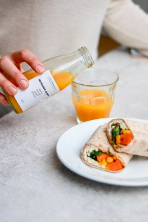Juice and Sweet Potato Wrap at Oliver Green - East in Amsterdam