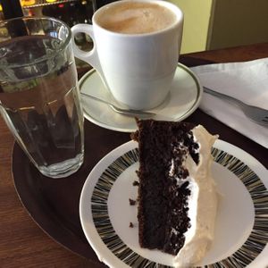 Chocolate and Stout cake and oat milk latte  at Fortify Cafe in Maidstone