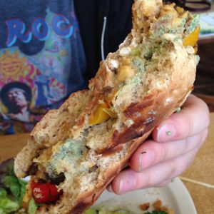 huge falafel burger with mint sauce at Fortify Cafe in Maidstone