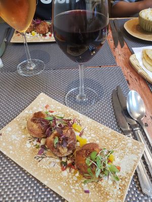 Thai-rancini (mushroom and chestnut rice balls) and vegan red wine at Giggling Squid in Windsor