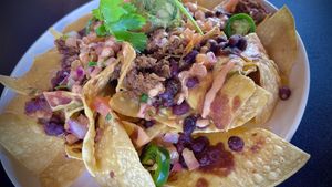 Southwestern Nachos 
Tex-Mex beefy crumbles, ranchero beans, organic guacamole, tortilla chips, pico de gallo, Cholula crema, and jalapenos  at Veggie Grill by Next Level in Burbank