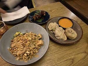 Pad see ew, mushroom skewers, and momos   at Plantasia in Mexico City