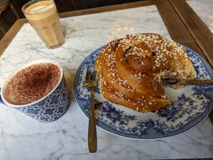 Hagabullen (Giant cinnamon bun) and vegan hot chocolate at Cafe Husaren in Gothenburg