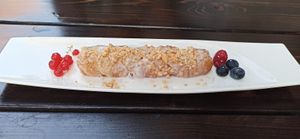 fried banana covered in rice and coconut cream at Soy in Munich