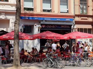 Front with outdoor seating at Bar Schmitz in Cologne