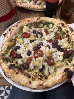 PIZZA V1 basil pesto, vegan cheese, red semi dried tomatoes, cauliflower, olives & potato  at Sano in Dublin