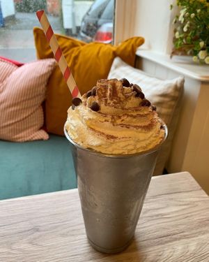 Vegan milkshake mixed with vegan ice cream with soya or oat milk topped with vegan squirty cream, either chocolate, strawberry, banana, vanilla or caramel at The Courtyard in Sidmouth