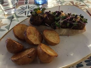 Asian balls sandwich with kimchinese and homemade potatoes at La Modernista in Madrid