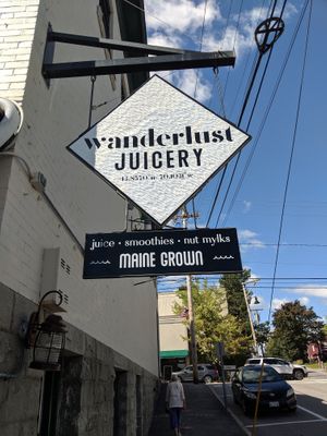 Sign outside if the jucery at Wanderlust Juicery in Freeport