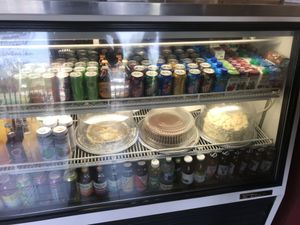 large case of drinks and vegan cakes at Loving Cafe in Fort Wayne