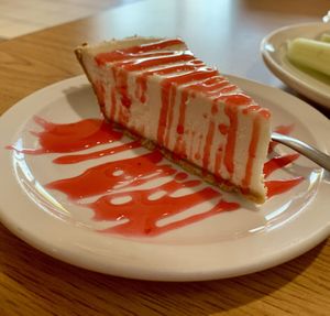 Cheesecake with strawberry drizzle   at Loving Cafe in Fort Wayne