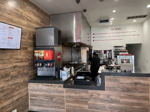 Two guys busting out great food at VOWburger in Los Angeles