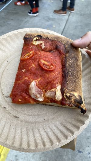 Vegan slice with tomato and garlic   at Scarr's Pizza in New York City