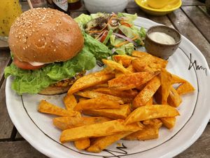 Moroccan chickpea burger, $4 with just a side salad or $6 with sweet potato fries or $7 in a meal deal (with the fries and a drink).  at Sacred Lotus Cafe in Phnom Penh
