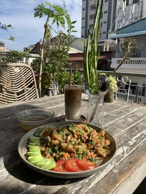 Fried rice with a soup and iced oat milk latte  at Sacred Lotus Cafe in Phnom Penh