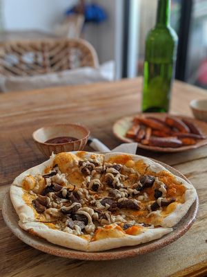 Meat feast pizza - wouldn't recommend at Sacred Lotus Cafe in Phnom Penh